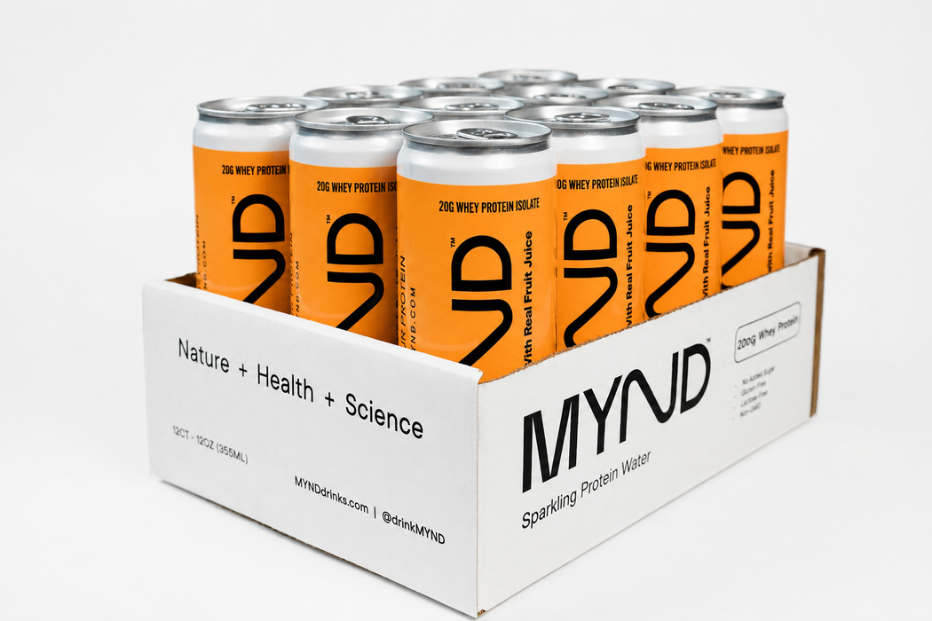 A white cardboard bulk carton filled with multiple cans of MYND Sparkling Protein Water. The cans have bright orange labels with a large black stylized '9' logo and text reading '20G WHEY PROTEIN GELATE'.