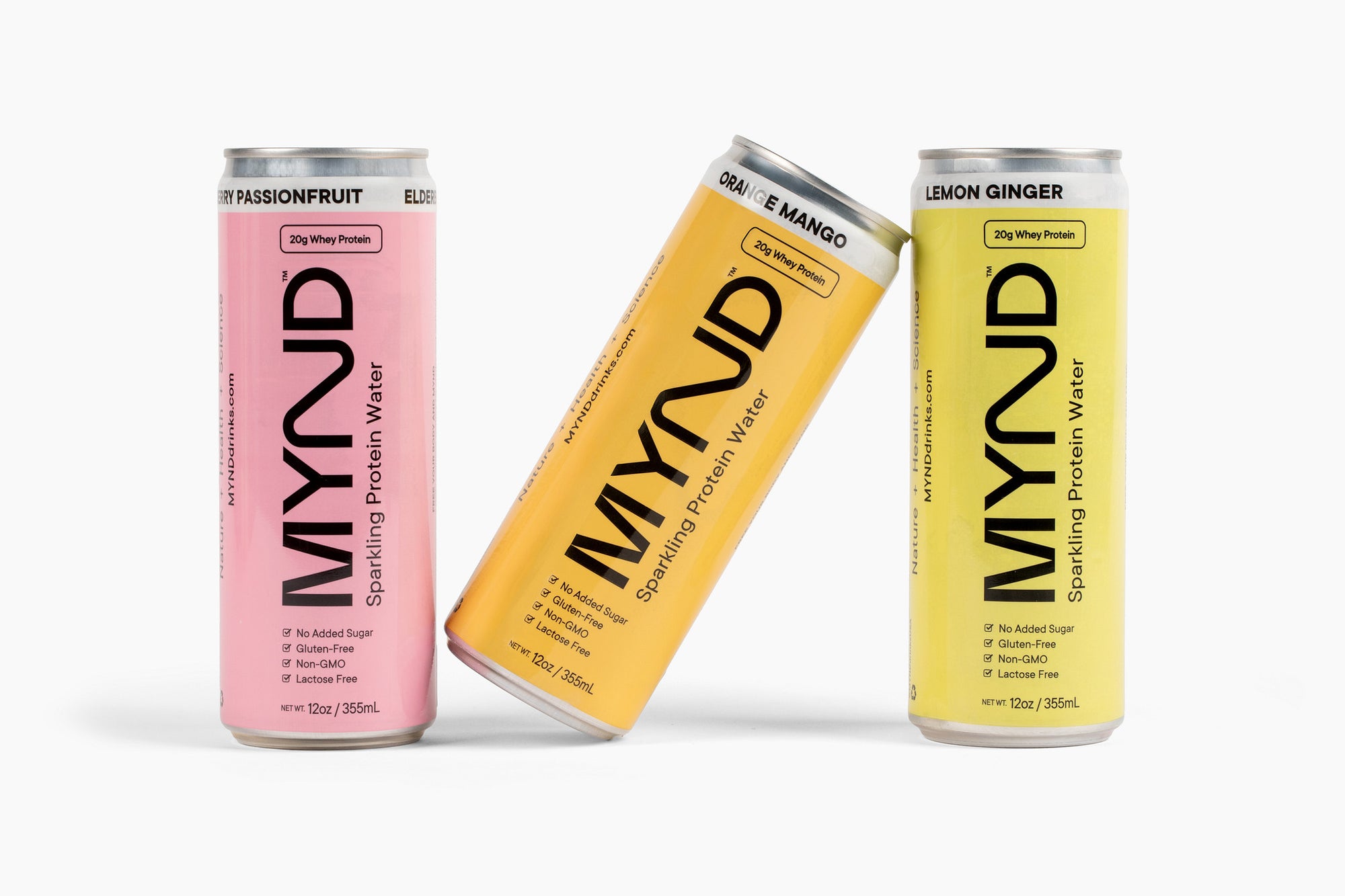 Three MYND branded cans in different flavors on a white background